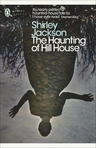 A grey cover, showing a puddle reflection with a woman within it.